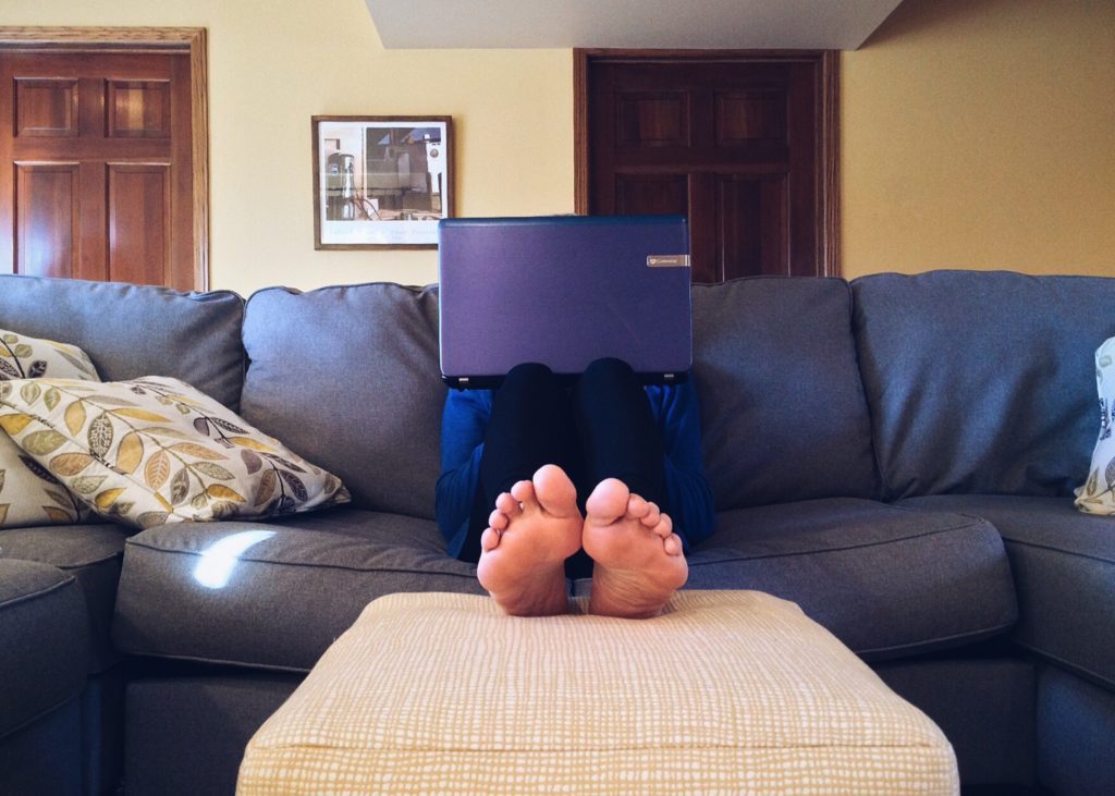 A person working from home on a couch